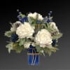 Like gazing into a clear blue sky, this serene arrangement soothes the