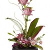 This towering topiary of asiatic lilies, orchids and roses - artistically arranged
