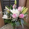  6 pink roses with oriental lilies in a vase designed at