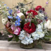 Refreshing mixed bouquet featuring blooms in red, blue and white. Airy movement