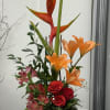 Bird of paradise flower, Lilies, alstroemerias, roses, ruscus and other greens. 