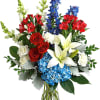 A colorful tribute for someone special, this brilliant arrangement of red, white