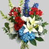 A colorful tribute for someone special, this brilliant arrangement of red, white