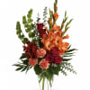 Red roses, red alstroemeria and orange gladioli in a sparkling Ming urn
