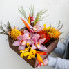 Unveil the beauty of the tropics in a box! This bouquet full