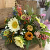 Sunflower, zinnias, snapdragons, and queen Ann&#039;s lace in a basket. 