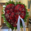 Sympathy red flowers heart, in easel.