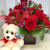 A fun bouquet filled with Red Carnations, Red Spray Roses, Red Roses
