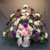 Basic funeral arrangement full of beautiful carnations.
