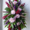 lucious, deep colored, full standing spray (seasonal florals shown: fuji mums) 