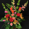Pretty combination of seasonal flowers with the addition of some roses. 