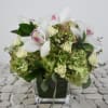 This cute little arrangement is perfect for a desk 
it comes in