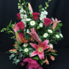 Hot colored roses and big luscious lilies.

Full and all premium assortment. Colors
