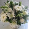 A white wicker basket full of white flowers is a great way