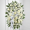 Elegant display of sweet serenity. White roses, Asiatic lilies, chrysanthemums and mini