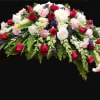 Red roses, snapdragon,  carnations,  stock and greenery 