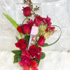 Elegant arrangement of red roses with chocolates and special details to give