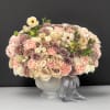 A beautifully gathered arrangement with specialty colors and flowers, all rested on
