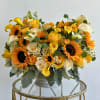 A sun-kissed mix of sunflowers, calla lilies, and roses.
