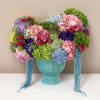A fascinating burst of color assorted with hydrangea.