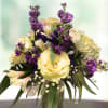 Made with stocks, roses, alstroemerias, baby&#039;s breath, and greenery.