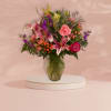 This traditional design is a mix of fresh and premium, seasonal flowers