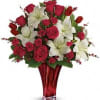 with this majestic mix of classic red roses, tulips and white lilies