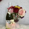 Bottle of pear cider, accompanied by a glass decorated with hearts, fresh