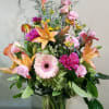 Colorful Asiatic Lilies, and Calla Lilies create a frangrant vase with Gerbera