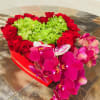 Stunning Heart of flowers with red roses and orchids 