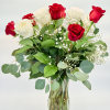Red and White Roses accented with Baby&#039;s Breath and assorted greenery in
