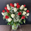 Red and White Roses accented with Baby&#039;s Breath and assorted greenery in