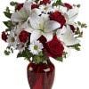 Roses and Daisies in a red glass vase, finished with a red