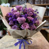 This beautiful modern bouquet of lavender colored flowers is sure to brighten