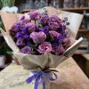 This beautiful modern bouquet of lavender colored flowers is sure to brighten
