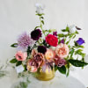 This sweet arrangement is the perfect gesture of love. It features blooms