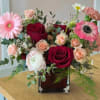 Tender Kiss features a lush combination of soft pinks and rich reds