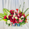 Beautiful arrangement of roses, spray roses, alstromeria, ferns, eucalyptus, lilies, and striped