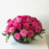 14 to 24 pink or hot pink roses in bowl or cylindrical
