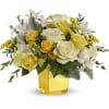 Like a ray of sunshine, this glorious yellow and white bouquet warms
