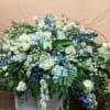 Mixture of Blue and White Seasonal Flowers  ( HALF CASKET SPRAY