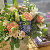 Hydrangeas, roses, lilies, stocks, pom buttons, bupleurums, eucalyptus