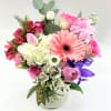 small mix flowers in pink color.Vase included.