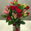 A bouquet of Red roses and pink lilies is a classic and