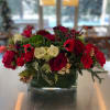 Holiday feels with reds, white and pine cones in 5x5 clear vase