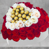 A modern flower arrangement in a heart box filled with roses &amp;