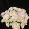 Exquisite and lush arrangement featuring peonies, one dozen roses, spray roses, ranunculus