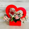 Soft pink arrangement with a roses, stock, babies breath in a nice