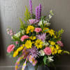Bright and feminine florals fill a large galvanized tin. A perfect arrangement