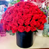 135 premium roses arranged in a black  container. Compact design.